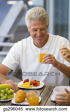 Stock Image - man with drink 
and fruit. fotosearch 
- search stock 
photos, pictures, 
images, and photo 
clipart