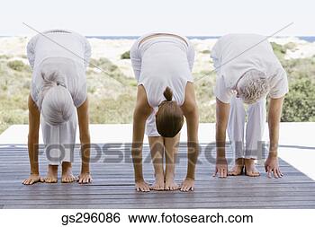 Stock Photo - people exercising 
by beach. fotosearch 
- search stock 
photos, pictures, 
images, and photo 
clipart