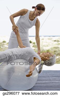 Picture - teacher by woman 
on exercise ball. 
fotosearch - search 
stock photos, 
pictures, images, 
and photo clipart