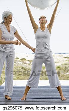 Stock Image - teacher by woman 
holding exercise 
ball. fotosearch 
- search stock 
photos, pictures, 
images, and photo 
clipart
