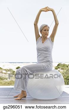 Stock Photography - woman on exercise 
ball. fotosearch 
- search stock 
photos, pictures, 
images, and photo 
clipart