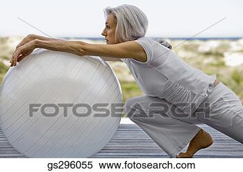 Stock Image - woman on exercise 
ball. fotosearch 
- search stock 
photos, pictures, 
images, and photo 
clipart
