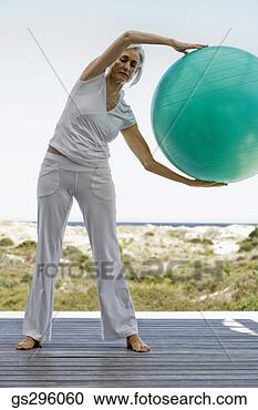 Stock Photography - woman on exercise 
ball. fotosearch 
- search stock 
photos, pictures, 
images, and photo 
clipart
