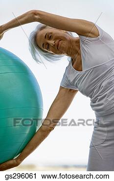 Stock Photography - woman on exercise 
ball. fotosearch 
- search stock 
photos, pictures, 
images, and photo 
clipart