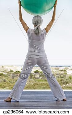 Stock Photo - woman on exercise 
ball. fotosearch 
- search stock 
photos, pictures, 
images, and photo 
clipart