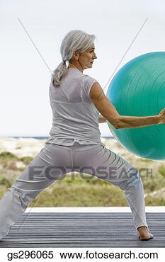 Stock Image - woman on exercise 
ball. fotosearch 
- search stock 
photos, pictures, 
images, and photo 
clipart