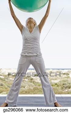 Stock Photo - woman on exercise 
ball. fotosearch 
- search stock 
photos, pictures, 
images, and photo 
clipart