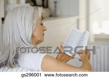 Stock Photography - woman reading 
book. fotosearch 
- search stock 
photos, pictures, 
images, and photo 
clipart