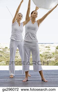 Stock Photo - women holding 
exercise ball. 
fotosearch - search 
stock photos, 
pictures, images, 
and photo clipart