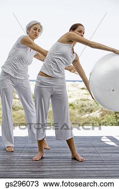 Stock Photo - women holding 
exercise ball. 
fotosearch - search 
stock photos, 
pictures, images, 
and photo clipart