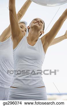Stock Photo - women holding 
exercise ball. 
fotosearch - search 
stock photos, 
pictures, images, 
and photo clipart