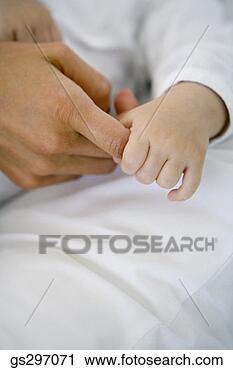 Stock Photography - baby holding person's 
finger. fotosearch 
- search stock 
photos, pictures, 
images, and photo 
clipart