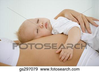 Stock Photograph - baby sleeping 
on pregnant woman's 
stomach. fotosearch 
- search stock 
photos, pictures, 
images, and photo 
clipart