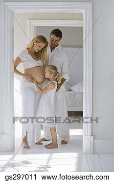Stock Photography - girl kissing pregnant 
mother's stomach. 
fotosearch - search 
stock photos, 
pictures, images, 
and photo clipart
