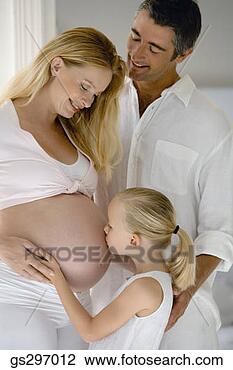 Stock Photo - girl kissing pregnant 
mother's stomach. 
fotosearch - search 
stock photos, 
pictures, images, 
and photo clipart