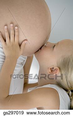 Stock Photograph - girl kissing pregnant 
mother's stomach. 
fotosearch - search 
stock photos, 
pictures, images, 
and photo clipart