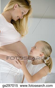 Stock Image - girl with pregnant 
mother. fotosearch 
- search stock 
photos, pictures, 
images, and photo 
clipart