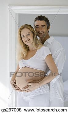 Stock Photo - man embracing 
pregnant woman. 
fotosearch - search 
stock photos, 
pictures, images, 
and photo clipart