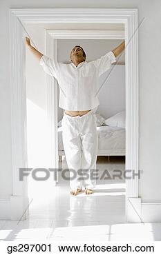 Stock Photography - man in pajamas 
stretching. fotosearch 
- search stock 
photos, pictures, 
images, and photo 
clipart