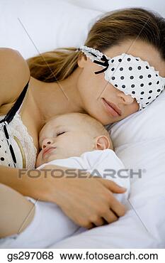 Stock Photo - mother sleeping 
with baby. fotosearch 
- search stock 
photos, pictures, 
images, and photo 
clipart