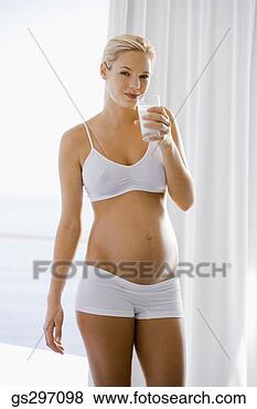 Stock Photo - pregnant woman 
drinking milk. 
fotosearch - search 
stock photos, 
pictures, images, 
and photo clipart