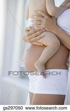 Stock Photography - pregnant woman 
holding child. 
fotosearch - search 
stock photos, 
pictures, images, 
and photo clipart
