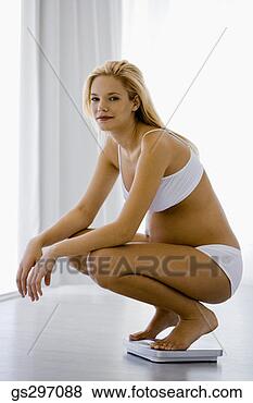 Stock Photo - pregnant woman 
on scale. fotosearch 
- search stock 
photos, pictures, 
images, and photo 
clipart