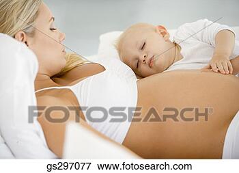 Picture - pregnant woman 
with sleeping 
baby. fotosearch 
- search stock 
photos, pictures, 
images, and photo 
clipart