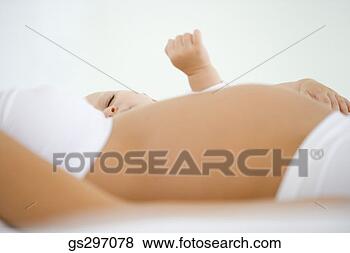 Stock Photo - pregnant woman 
with sleeping 
baby. fotosearch 
- search stock 
photos, pictures, 
images, and photo 
clipart