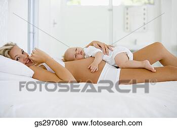 Stock Photography - pregnant woman 
with sleeping 
baby. fotosearch 
- search stock 
photos, pictures, 
images, and photo 
clipart