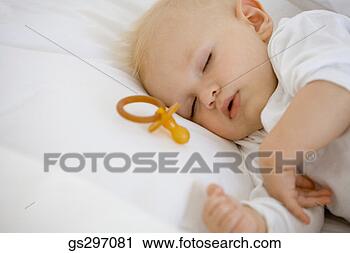 Stock Photography - sleeping baby 
with pacifier. 
fotosearch - search 
stock photos, 
pictures, images, 
and photo clipart