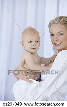 Stock Photograph - smiling mother 
with baby. fotosearch 
- search stock 
photos, pictures, 
images, and photo 
clipart