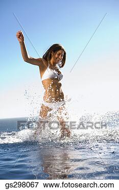 Picture - woman splashing 
in sea. fotosearch 
- search stock 
photos, pictures, 
images, and photo 
clipart