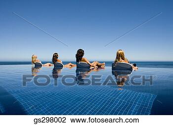 Stock Photo - women lounging 
in infinity pool. 
fotosearch - search 
stock photos, 
pictures, images, 
and photo clipart