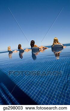 Stock Photo - women lounging 
in infinity pool. 
fotosearch - search 
stock photos, 
pictures, images, 
and photo clipart