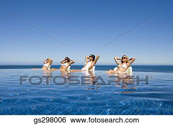 Stock Photo - women lounging 
in infinity pool. 
fotosearch - search 
stock photos, 
pictures, images, 
and photo clipart