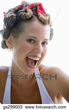 Stock Photo - smiling woman 
wearing curlers. 
fotosearch - search 
stock photos, 
pictures, images, 
and photo clipart