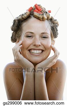 Stock Photo - smiling woman 
wearing curlers. 
fotosearch - search 
stock photos, 
pictures, images, 
and photo clipart
