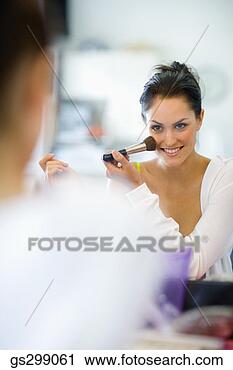 Stock Photography - woman applying 
makeup. fotosearch 
- search stock 
photos, pictures, 
images, and photo 
clipart