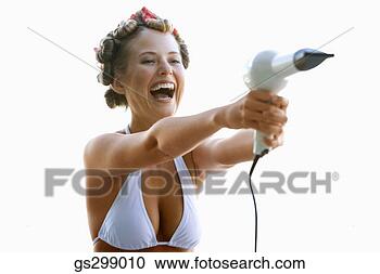 Stock Photography - woman with blow-dryer. 
fotosearch - search 
stock photos, 
pictures, images, 
and photo clipart