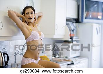Stock Photo - woman in lingerie 
stretching. fotosearch 
- search stock 
photos, pictures, 
images, and photo 
clipart