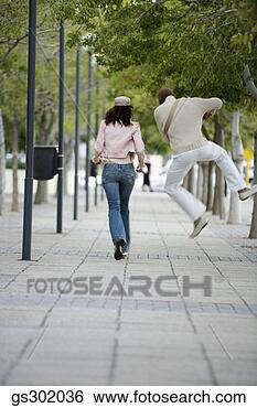 Stock Photo - excited man walking 
outdoors. fotosearch 
- search stock 
photos, pictures, 
images, and photo 
clipart