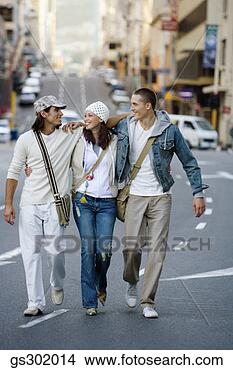 Stock Photo - friends walking 
down street. fotosearch 
- search stock 
photos, pictures, 
images, and photo 
clipart