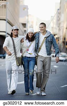 Stock Photo - friends walking 
in street. fotosearch 
- search stock 
photos, pictures, 
images, and photo 
clipart
