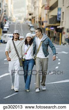 Stock Photo - friends walking 
in street. fotosearch 
- search stock 
photos, pictures, 
images, and photo 
clipart