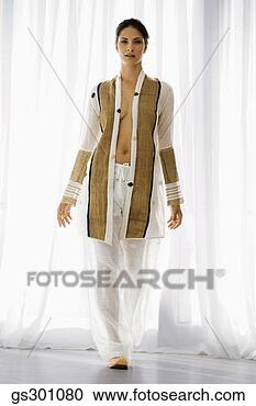 Stock Photography - beautiful woman 
standing indoors. 
fotosearch - search 
stock photos, 
pictures, images, 
and photo clipart