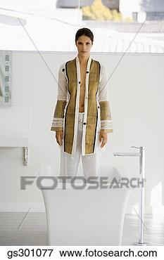 Picture - woman standing 
in a bathtub. 
fotosearch - search 
stock photos, 
pictures, images, 
and photo clipart