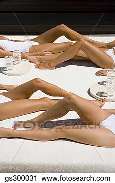 Stock Photography - women sunbathing. 
fotosearch - search 
stock photos, 
pictures, images, 
and photo clipart