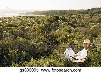 Stock Image - man relaxing outdoors. 
fotosearch - search 
stock photos, 
pictures, images, 
and photo clipart