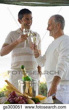 Stock Photography - men toasting glasses 
of champagne. 
fotosearch - search 
stock photos, 
pictures, images, 
and photo clipart